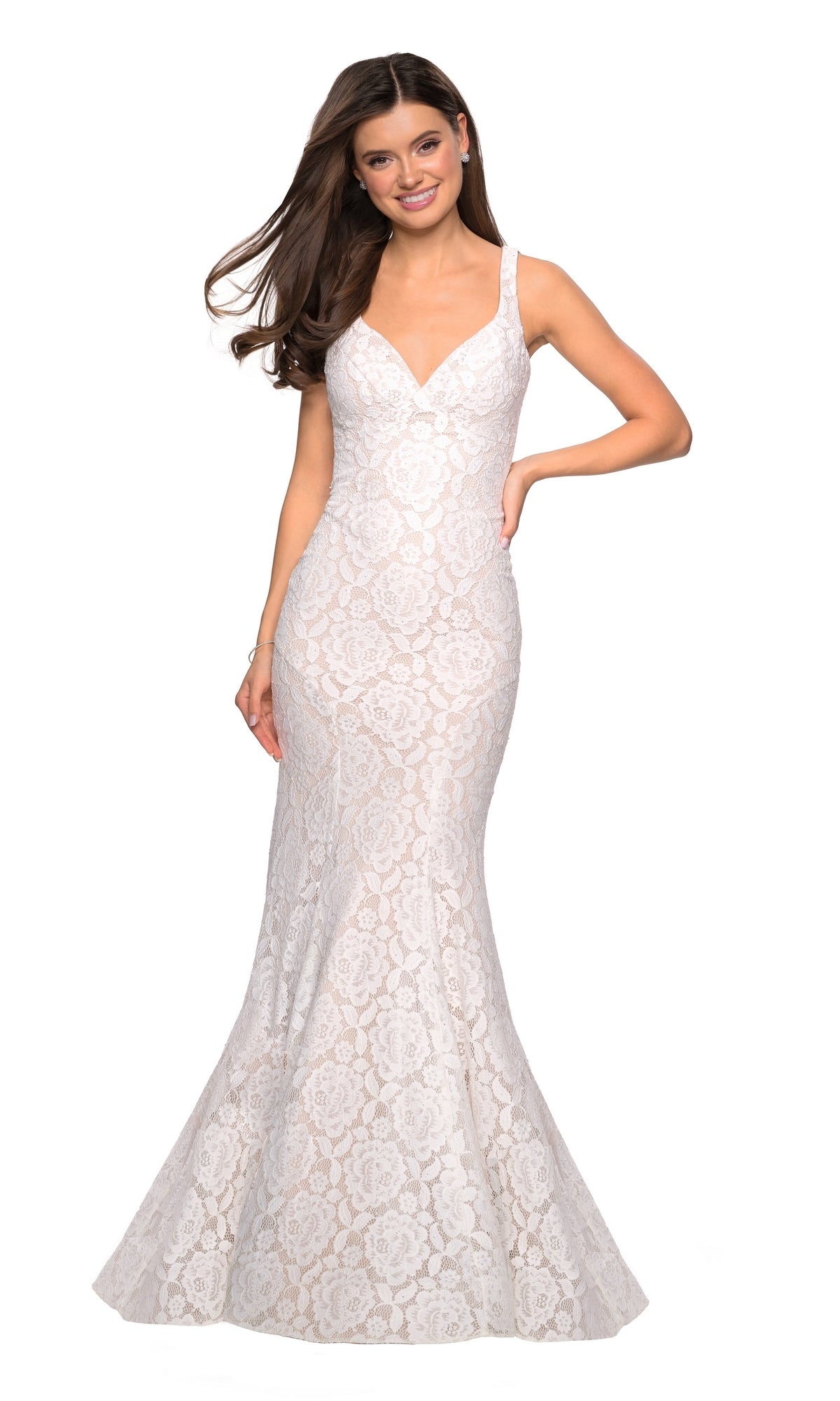 A woman wearing the La Femme 27623 Open-Back Lace Mermaid Prom Dress, a sleeveless, floor-length gown with a V-neckline, poses and smiles against a plain white background.